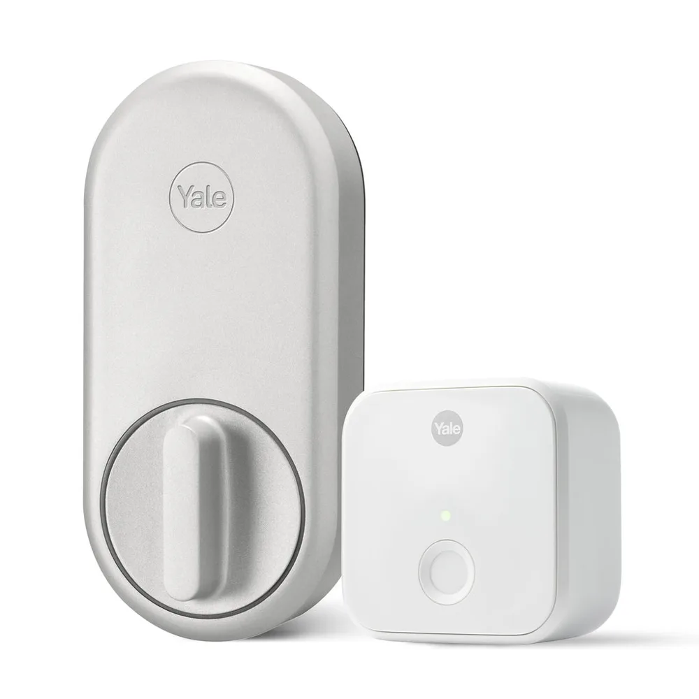 Yale Approach smart lock in silver with its Wi-Fi bridge